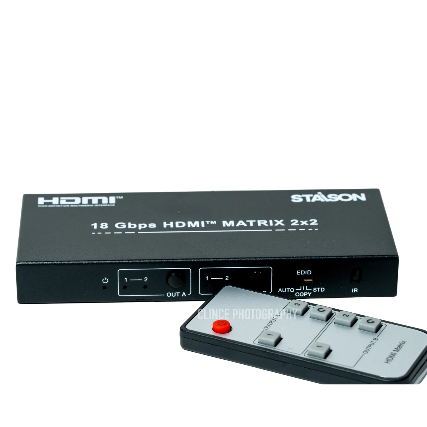 HDMI matrix switcher with remote control on a white background
